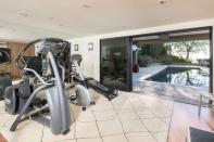 <p>The private gym looks onto the swimming pool. Now we know how The 'Grace & Frankie' star keeps in shape.</p>
