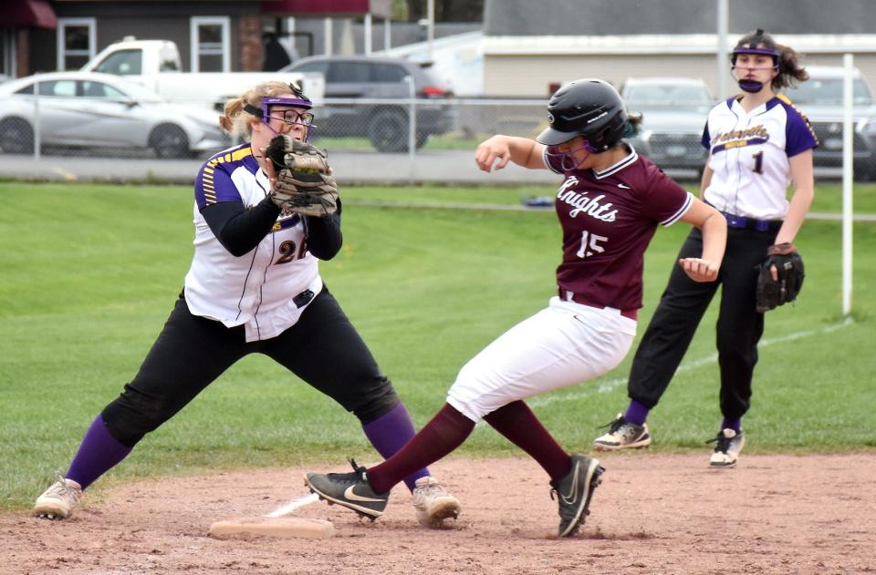 Frankfort-Schuyler Maroon Knight Olivia Urtz (right) reaches for the bag with her toe ahead of the tag from Waterville third baseman Katie Sullivan Friday, May 6, 2022, in Frankfort, New York.