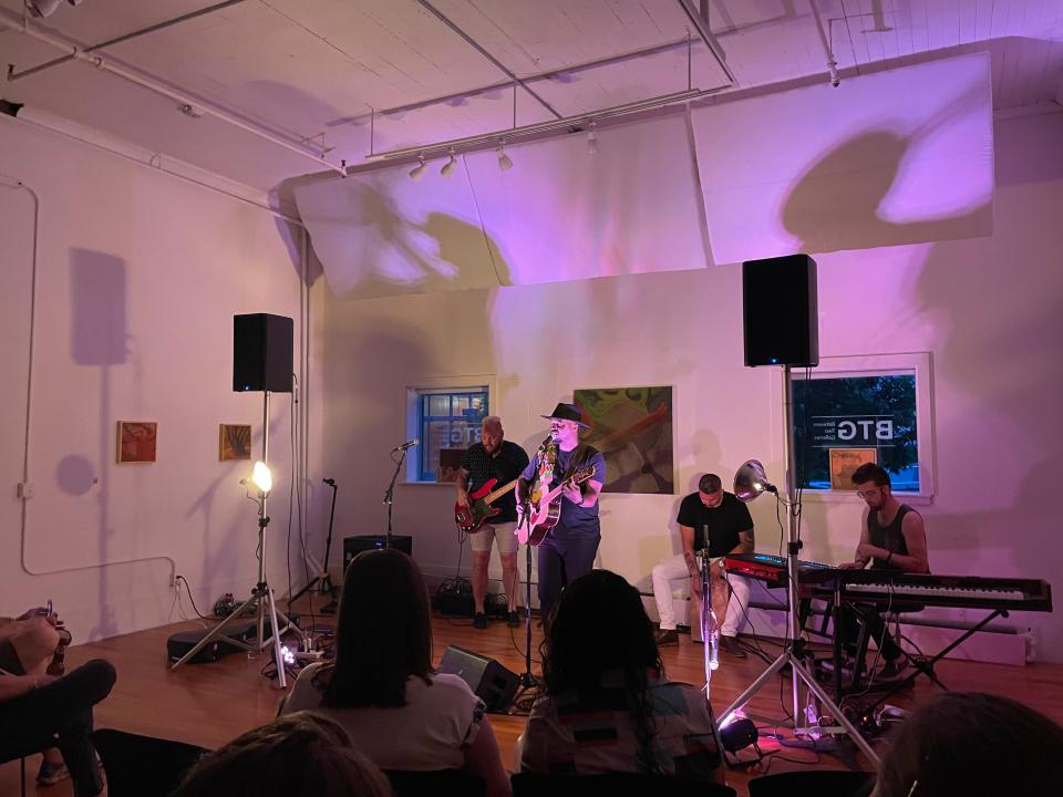 Ben Mulwana, second from left, performs with Patrick Greer, left, on bass, Rafael Escobedo, second from right, on cajo, and Justin Hall, right, on keyboard, at a Sofar Sounds show June 15 at Between Two Galleries, located inside the Var Gallery building.