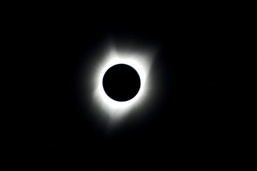 People watching a solar eclipse at the Lowell Observatory Solar Eclipse Experience at Madras High School in Madras, Oregon on August 21, 2017. REUTERS