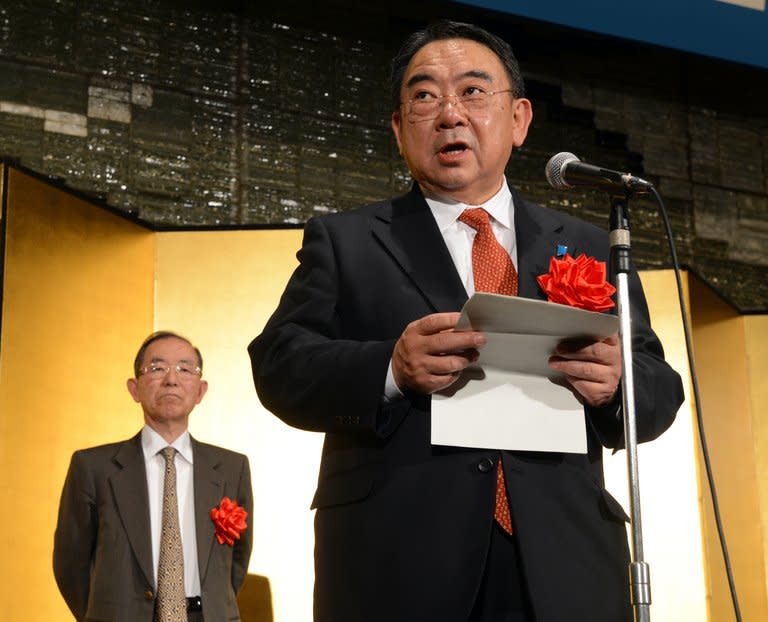 New Japanese ambassador to China Masato Kitera (R) delivers a speech while former ambassador Uichiro Niwa listens during a reception in Tokyo, on December 20, 2012