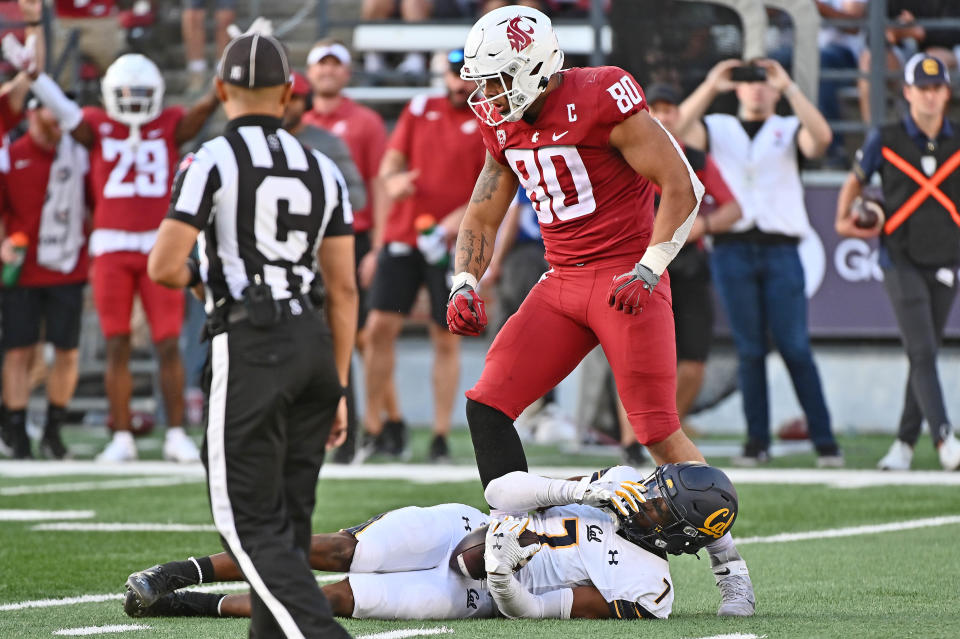 Oct 1, 2022; Pullman, Washington, USA; Washington State Cougars defensive end Brennan Jackson (80) celebrates after a tackle of California Golden Bears wide receiver J. Michael Sturdivant (7) in the second half at Gesa Field at Martin Stadium. Washington State won 28-9. Mandatory Credit: James Snook-USA TODAY Sports