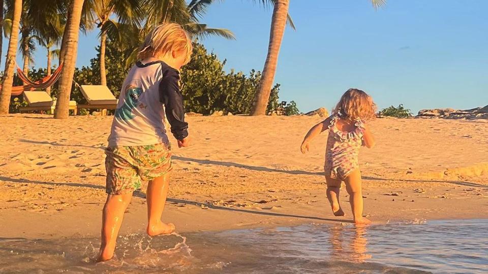 Carrie Johnson's children, Wilfred and Romy, playing on the beach