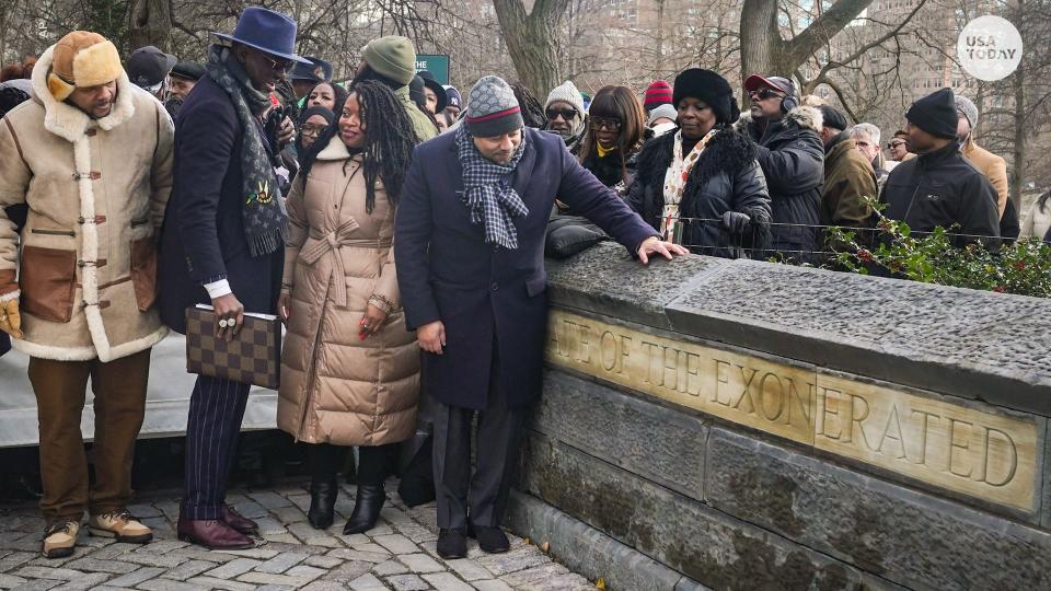 Kevin Richardson, far left, Yusef Salaam, second from left, and Raymond Santana Jr., far right foreground, three of the men exonerated after being wrongfully convicted as teenagers for the 1989 rape of a jogger in Central Park, along with Cicely Harris, second from right, chair of Harlem's Community Board 10, unveil the "The Gate of the Exonerated" at Central Park in 2022.