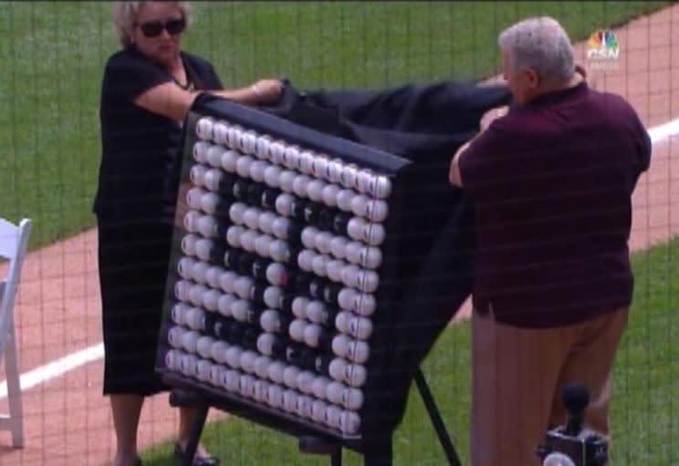 Mark Buehrle is presented with a cool piece of art put together by Ron Kittle. (Comcast SportsNet Chicago)