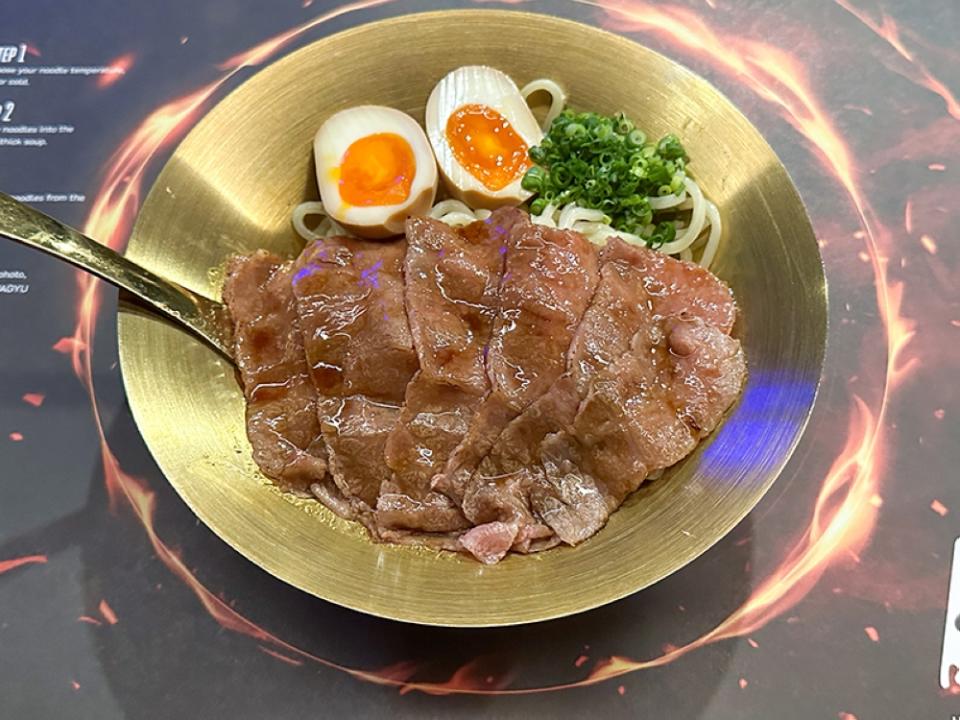 The bowl of Tsukumen is topped with torched Japanese A5 Miyazaki beef, where the cold noodles can be dipped in a beef sauce.