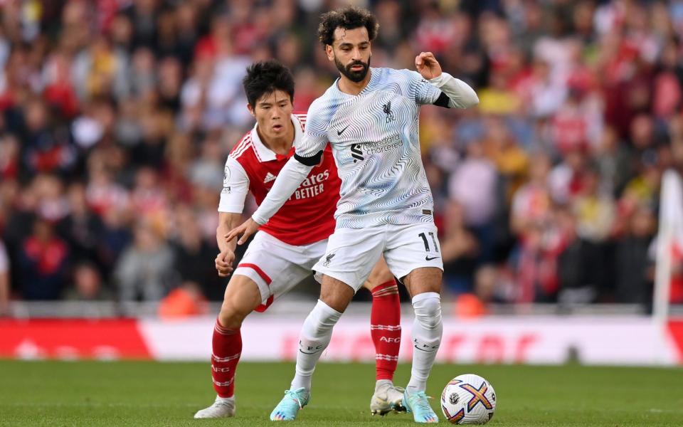 Takehiro Tomiyasu up against Mohamed Salah during Arsenal's win over Liverpool