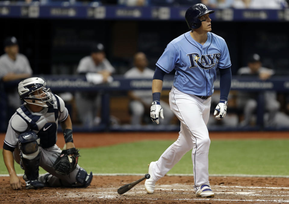 Tampa Bay Rays' Logan Morrison, right, watches his home run off New York Yankees starting pitcher Masahiro Tanaka during the third inning of a baseball game Sunday, April 2, 2017, in St. Petersburg, Fla. Yankees catcher Gary Sanchez, left, looks on. (AP Photo/Chris O'Meara)