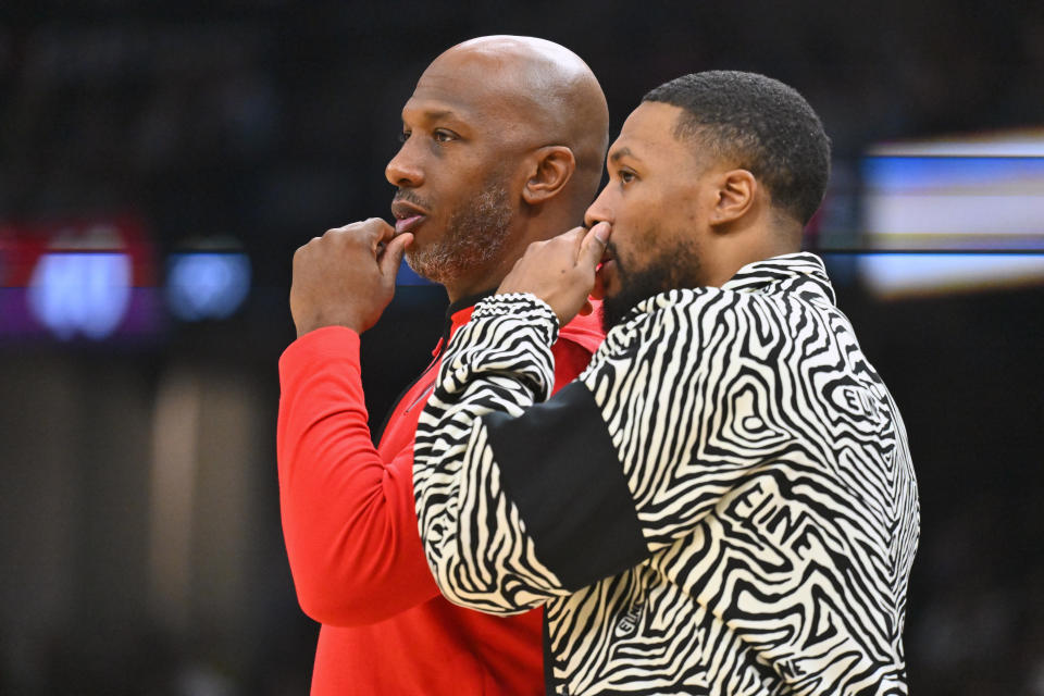 Portland Trail Blazers head coach Chauncey Billups talks to Damian Lillard during a 2022 game. Lillard was traded to the Milwaukee Bucks before this season. (Photo by Jason Miller/Getty Images)