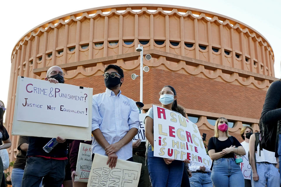 Students for Socialism protest on campus demanding that Kyle Rittenhouse not be allowed to enroll at Arizona State University, Wednesday, Dec. 1, 2021, at ASU in Tempe, Ariz. Protesters were demanding the university disavow the 18-year-old, who was acquitted of murder last month in the deadly shootings during last year's unrest in Kenosha. (AP Photo/Matt York)