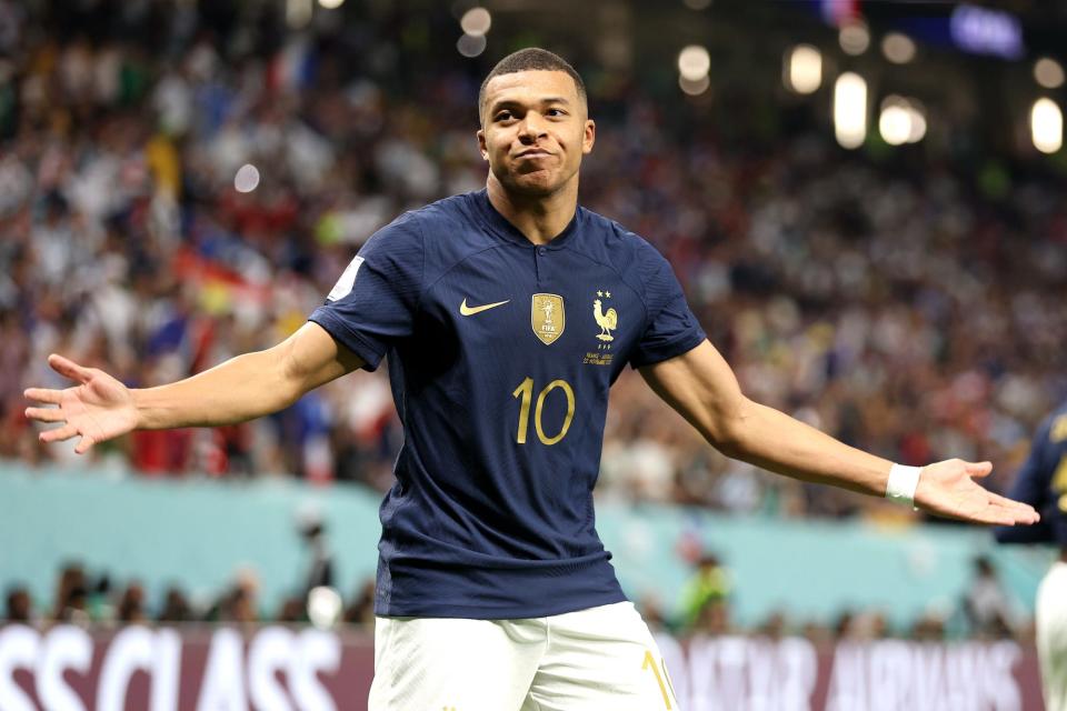 Kylian Mbappe of France celebrates after scoring their team's third goal past Harry Souttar of Australia during the FIFA World Cup Qatar 2022 Group D match between France and Australia at Al Janoub Stadium on November 22, 2022 in Al Wakrah, Qatar.