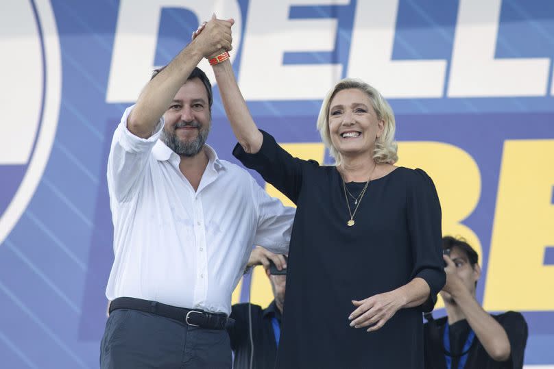 Italian populist, right-wing Vice Premier Matteo Salvini stands on stage with French right-wing leader Marine Le Pen at his annual Lega party rally in Pontida, September 2023