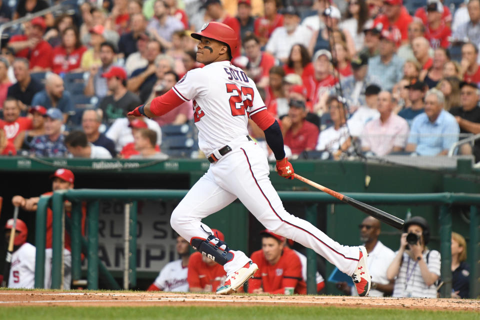 WASHINGTON, DC - JULY 19:  Juan Soto #22 of the Washington Nationals hits a solo home run in the first inning during a baseball game against the Miami Marlins at Nationals Park on July 19, 2021 in Washington, DC.  (Photo by Mitchell Layton/Getty Images)