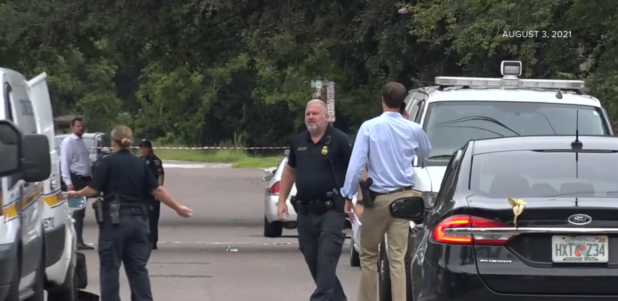 Investigators with the Jacksonville Sheriff's Office work the crime scene of a stabbing death and arson at a home on Brooklyn Road on Aug. 3, 2021.