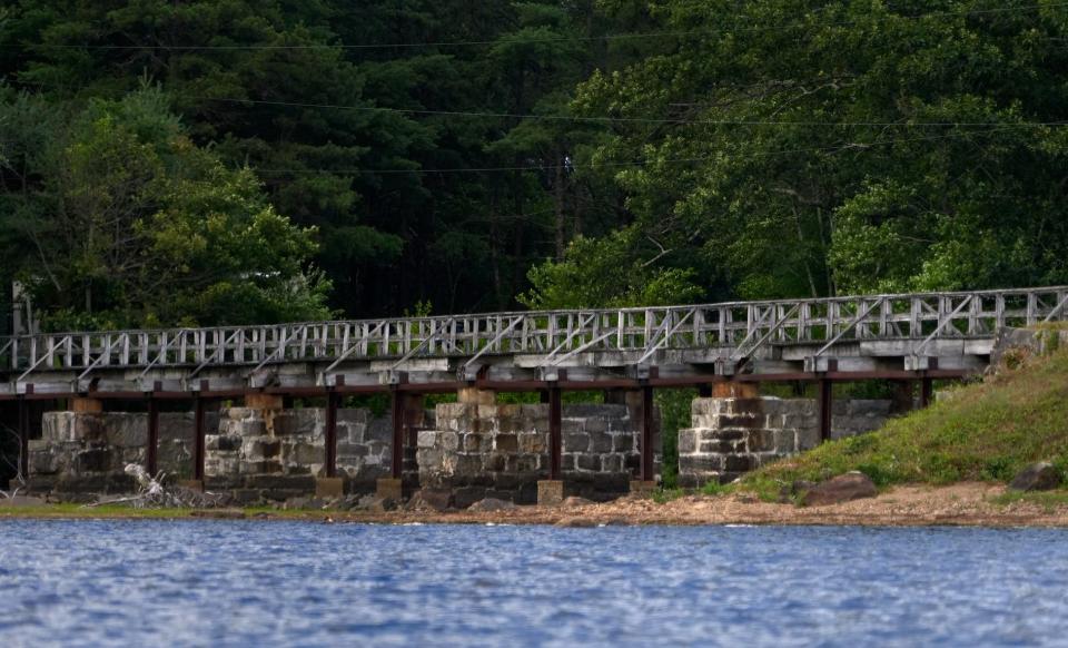 The dam that controls the water level at Johnson's Pond is in serious disrepair, with jets of water spurting from gaps in the stone wall of the dam's spillway. The DEM has ordered Coventry to keep water levels lower than usual until it can be fixed.