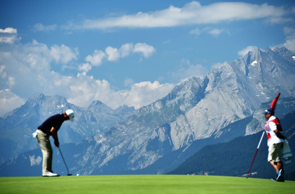 A player putts with the Alps in the background during the second round of the Omega European Masters at Crans-sur-Sierre Golf Club on July 24, 2015 in Crans-Montana, Switzerland. (Photo by Stuart Franklin/Getty Images) 