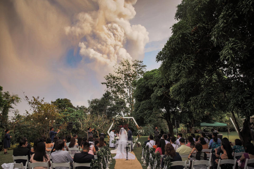 Chino Vaflor and Kat Bautista Palomar who marry in Alfonso, Cavite in the Philippines a short distance from the Taal volcano eruption.