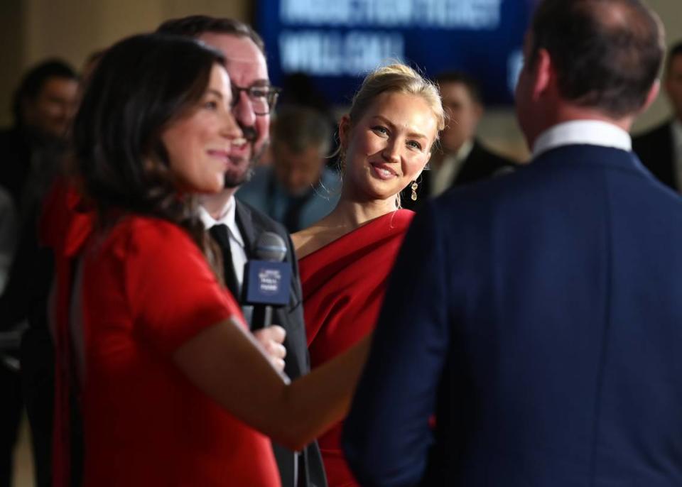 Brooke Knaus, center, smiles at her husband, NASCAR Hall of Fame member Chad Knaus on the red carpet at the NASCAR Hall of Fame in Charlotte, NC on Friday, January 19, 2024.