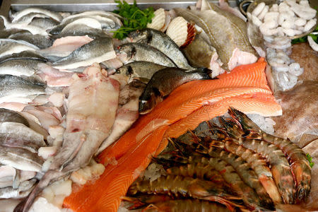 FILE PHOTO: Fish lay on ice at a fishmongers in Newlyn, Britain August 10, 2017. REUTERS/Neil Hall/File Photo