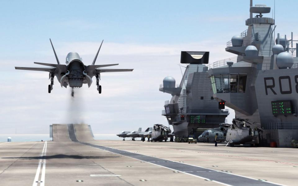 Ministry of Defence computer generated image showing a F-35B Lightning II jet landing vertically on the Royal Navy's new aircraft carrier HMS Queen Elizabeth - BAE Systems/PA