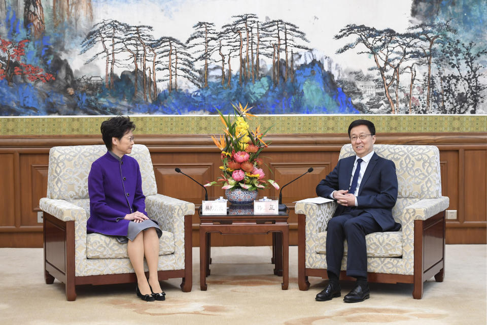 In this Wednesday, Nov. 6, 2019, photo released by Xinhua News Agency, Hong Kong Chief Executive Carrie Lam, left, meets with Chinese Vice Premier Han Zheng as they attend a meeting of the leading group for developing the Guangdong-Hong Kong-Macao Greater Bay Area, in Beijing. Lam, on a visit to the mainland, met with President Xi Jinping in Shanghai on Monday in what was seen as an endorsement of her government's handling of the protests in Hong Kong. Vice Premier Han Zheng reiterated the support Wednesday after talks with Lam in Beijing. (Zhang Ling/Xinhua via AP)