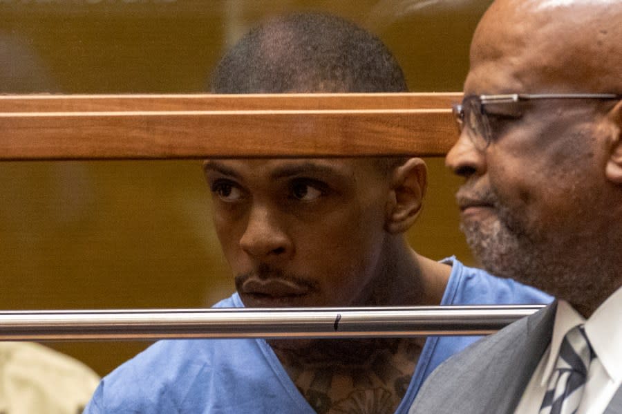 Eric Ronald Holder Jr., 29, who is accused of killing of rapper Nipsey Hussle, appears for arraignment in Los Angeles with then-attorney Christopher Darden on April 4, 2019. (Credit: Patrick Fallon / Getty Images)