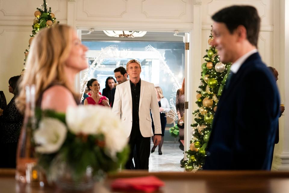 Elisabeth Shue as Ali Mills, from left, William Zabka as Johnny Lawrence and Ralph Macchio as Daniel LaRusso in Season 3, Episode 10 of "Cobra Kai" on Netflix.