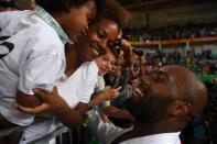 <p>Teddy Riner of France greets his son Eden and girfriend Luthna Plocus after his Men’s +100kg Judo final match on Day 7 of the Rio 2016 Olympic Games at Carioca Arena 2 on August 12, 2016 in Rio de Janeiro, Brazil. (Photo by Pascal Le Segretain/Getty Images) </p>