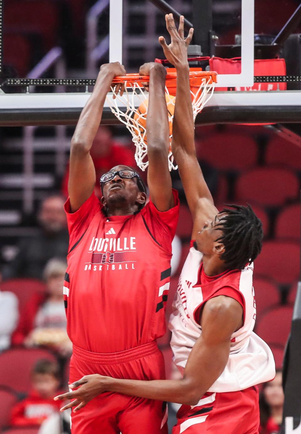 Louisville freshman Dennis Evans dunks during the Red and White scrimmage.