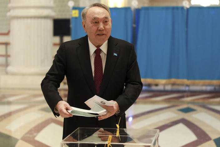 Kazakhstan's former president Nursultan Nazarbayev casts his ballot at a polling station in Astana, Kazakhstan, Sunday, March 19, 2023. Voters in Kazakhstan cast ballots on Sunday after a short but active campaign for seats in the lower house of parliament that is being reconfigured in the wake of deadly unrest that gripped the resource-rich Central Asian nation a year ago. (AP Photo/Ilyas Omarov)