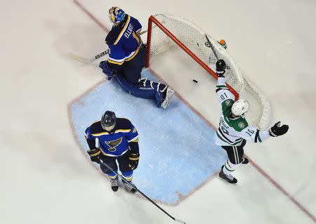 Dallas Stars left wing Patrick Sharp (10) celebrates after the game winning goal scored by Cody Eakin (not pictured) against St. Louis Blues goalie Brian Elliott (1) during the overtime period in game four of the second round of the 2016 Stanley Cup Playoffs at Scottrade Center. The Dallas Stars defeat the St. Louis Blues 3-2. Mandatory Credit: Jasen Vinlove-USA TODAY Sports