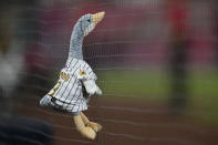 A stuffed toy goose is hanging on the net during the ninth inning in Game 1 of the baseball NL Championship Series between the San Diego Padres and the Philadelphia Phillies on Tuesday, Oct. 18, 2022, in San Diego. (AP Photo/Gregory Bull)