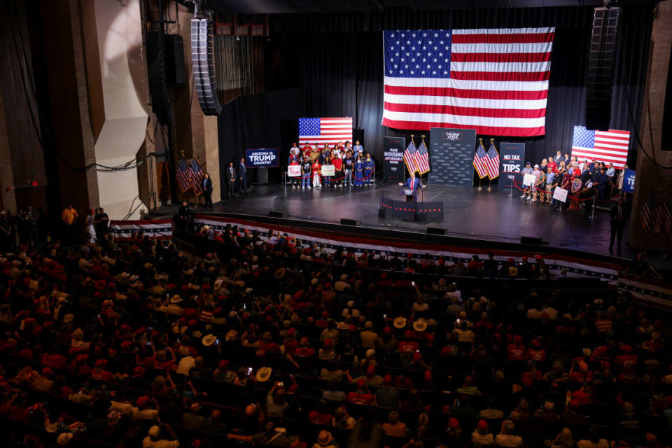 The crowd looks on as Donald Trump discusses an anti-immigrant conspiracy theory involving Haitian migrants stealing and eating people’s pets.