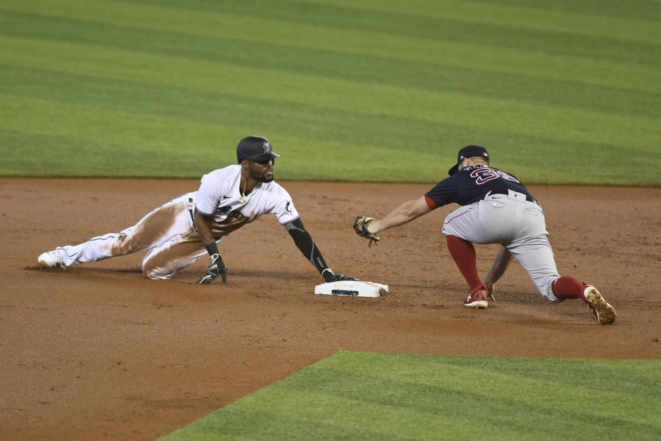 Miami Marlins Starling Marte slides safe to second base during the first inning of a baseball game against the Boston Red Sox, Thursday, Sept. 17, 2020, in Miami. (AP Photo/Gaston De Cardenas)