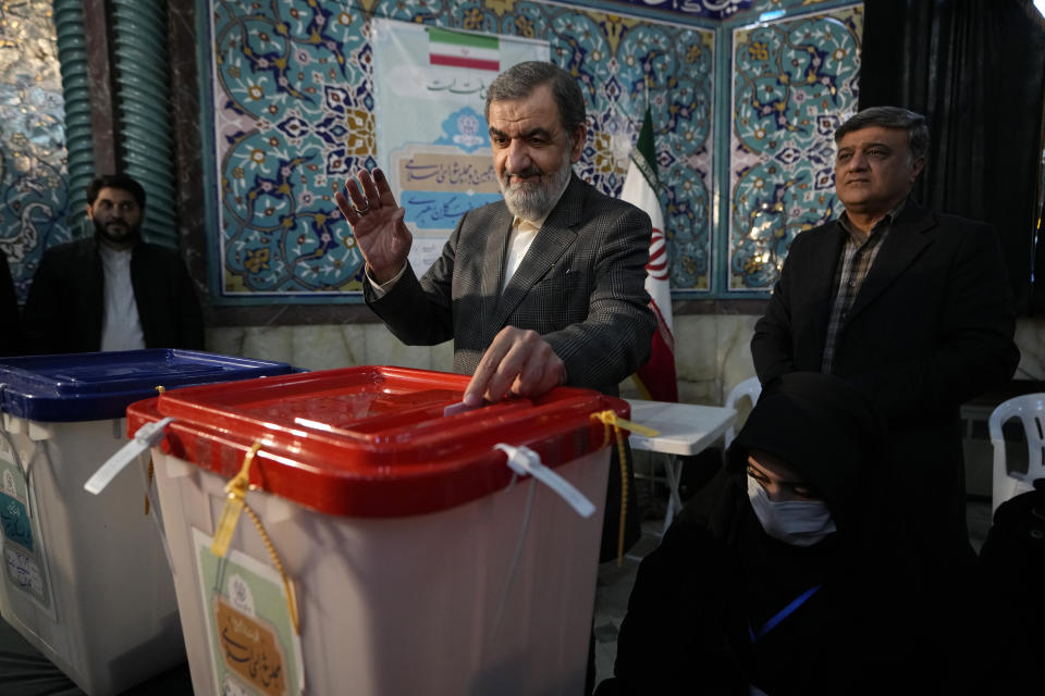Former Revolutionary Guard commander Mohsen Rezaei casts his ballot during the parliamentary and Assembly of Experts elections at a polling station in Tehran, Iran, Friday, March 1, 2024. Iran began voting Friday in its first elections since the mass 2022 protests over its mandatory hijab laws after the death of Mahsa Amini, with questions looming over just how many people will turn out for the poll. (AP Photo/Vahid Salemi)