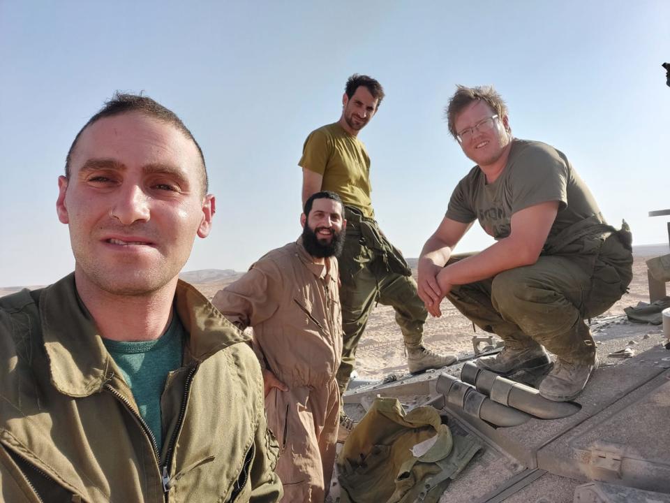 Yoav Atzmoni (left), Eytan Marmelstein, Omer Bauman and Yulav Shtaigel (right) on a tank in Israel