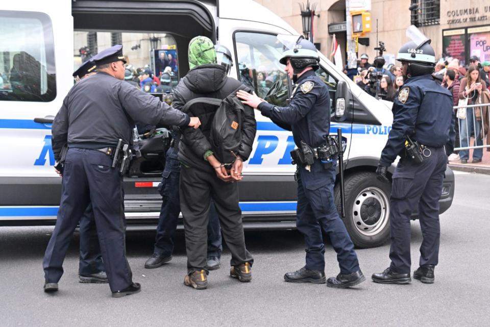 Arrested protesters being loaded into an NYPD van. Paul Martinka