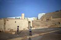 Boys play outside a fort that was converted into a photography museum overlooking the Atlantic Ocean, in Rabat, Morocco, Tuesday, Sept. 22, 2020. (AP Photo/Mosa'ab Elshamy)