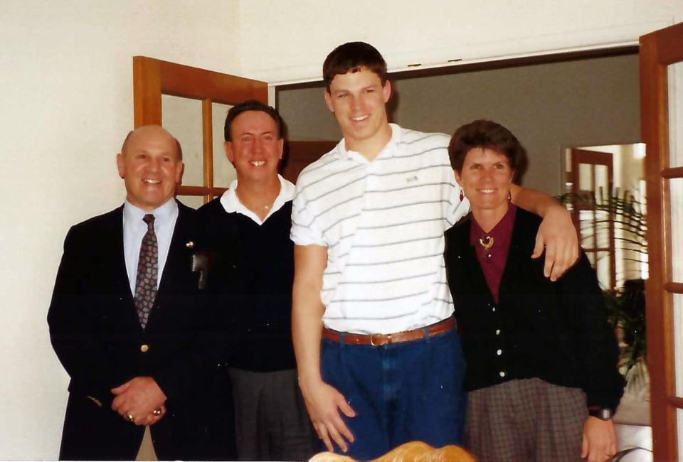 Tony Boselli with his mom, dad and a recruiter from USC, left.