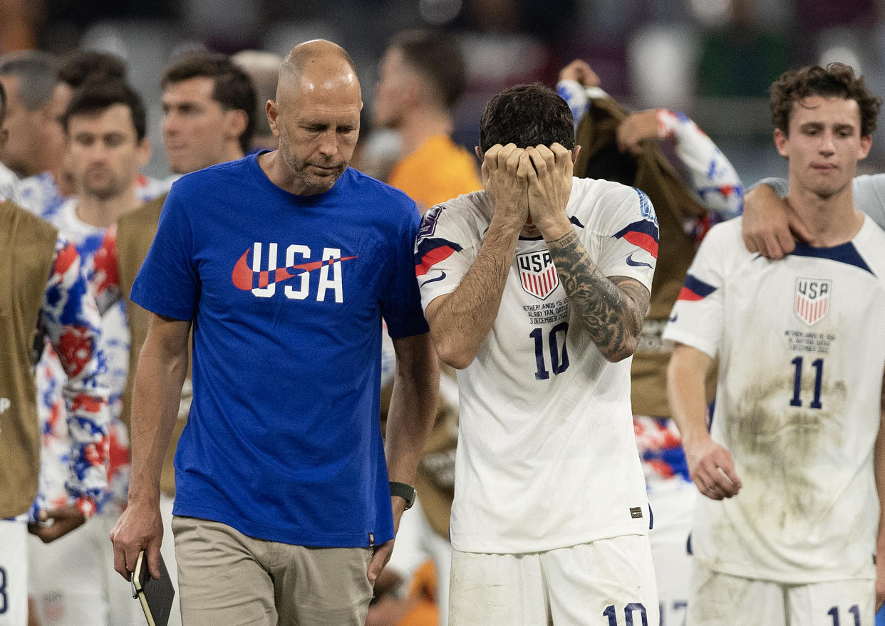 DOHA, QATAR - DECEMBER 03:  Christian Pulisic of USA is consoled by Head Coach Gregg Berhalter after defeat in  the FIFA World Cup Qatar 2022 Round of 16 match between Netherlands and USA at Khalifa International Stadium on December 03, 2022 in Doha, Qatar. (Photo by Visionhaus/Getty Images)