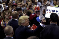 <p>Republican presidential nominee Donald Trump holds up a <em>Playboy</em> magazine handed to him by a supporter after speaking at a campaign rally in Pensacola, Fla., Sept. 9, 2016. (Photo: Mike Segar/Reuters) </p>