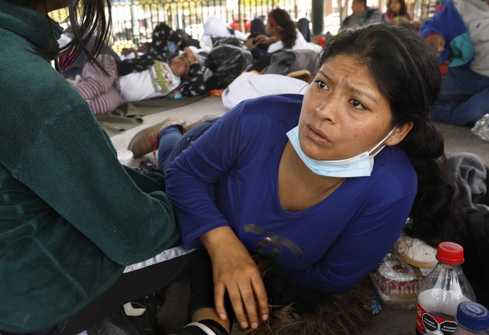 People rest in a central plaza in Reynoso, Mexico.