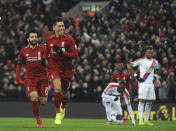 Liverpool's Roberto Firmino, centre, celebrates after scoring his side's second goal during the English Premier League soccer match between Liverpool and Crystal Palace at Anfield in Liverpool, England, Saturday, Jan. 19, 2019. (AP Photo/Rui Vieira)