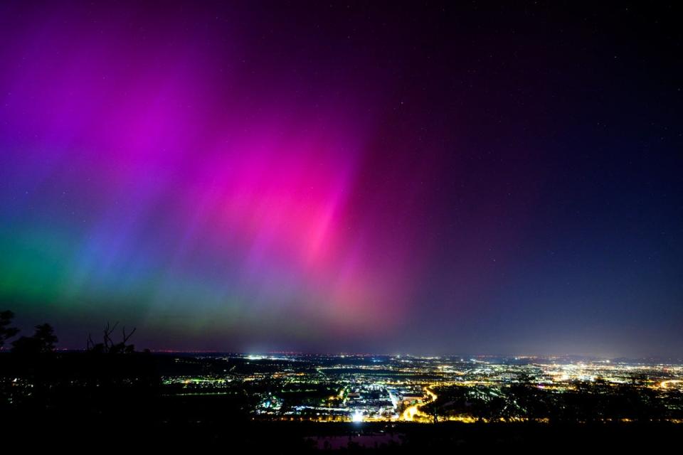 Northern lights or aurora borealis illuminate the night sky over Vienna during a geomagnetic storm on May 11, 2024 (APA/AFP via Getty Images)