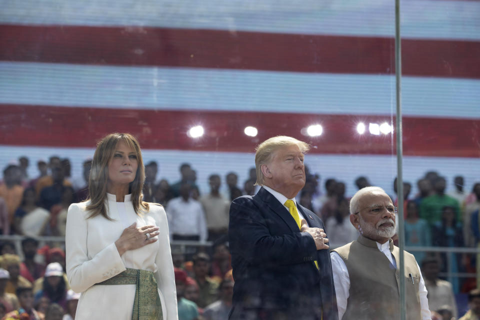 U.S. President Donald Trump, first lady Melania Trump and Indian Prime Minister Narendra Modi stand during the national anthem during a "Namaste Trump," event at Sardar Patel Gujarat Stadium, Monday, Feb. 24, 2020, in Ahmedabad, India. (AP Photo/Alex Brandon)