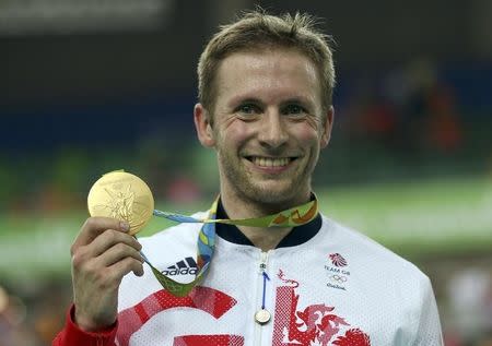 Jason Kenny (GBR) of Britain poses with the gold medal. REUTERS/Matthew Childs