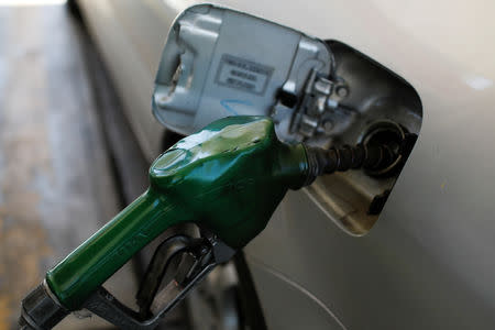 A fuel nozzle is seen at a gas station of the Venezuelan state-owned oil company PDVSA in Caracas, Venezuela August 17, 2018. REUTERS/Marco Bello