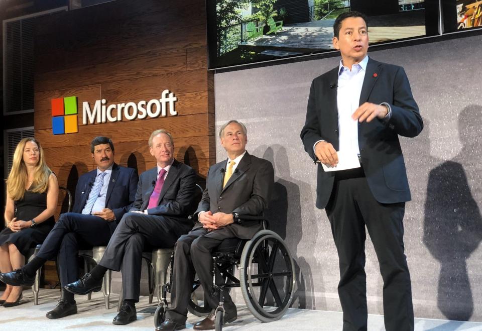 Ricardo Mora, co-founder and CEO of Juarez Technology Hub, speaks in October 2019 at a Microsoft event in El Paso.  From left to right, Texas Governor Greg Abbott, Microsoft President Brad Smith, then-Chihuahua Governor Javier Corral, and Alejandra de la Vega-Foster, then-Chihuahua economic development official, listen.