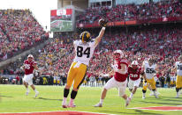 Iowa's Sam LaPorta (84) reaches for a pass under pressure from Nebraska's Luke Reimer (28) in the end zone during the first half of an NCAA college football game Friday, Nov. 26, 2021, at Memorial Stadium in Lincoln, Neb. Initially called a touchdown, the call was reversed after review.(AP Photo/Rebecca S. Gratz)