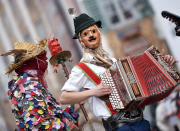 <p>Traditional carnival characters parade through the streets of Mittenwald, southern Germany, as the hot carnival season starts on Women’s Carnival, Feb. 23, 2017. (Photo: Angelika Warmuth/AFP/Getty Images) </p>